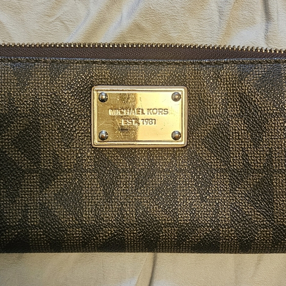 Michael Kors Handbags - Michael Kors Brown Monogram Coated Cavas Zip around Wallet